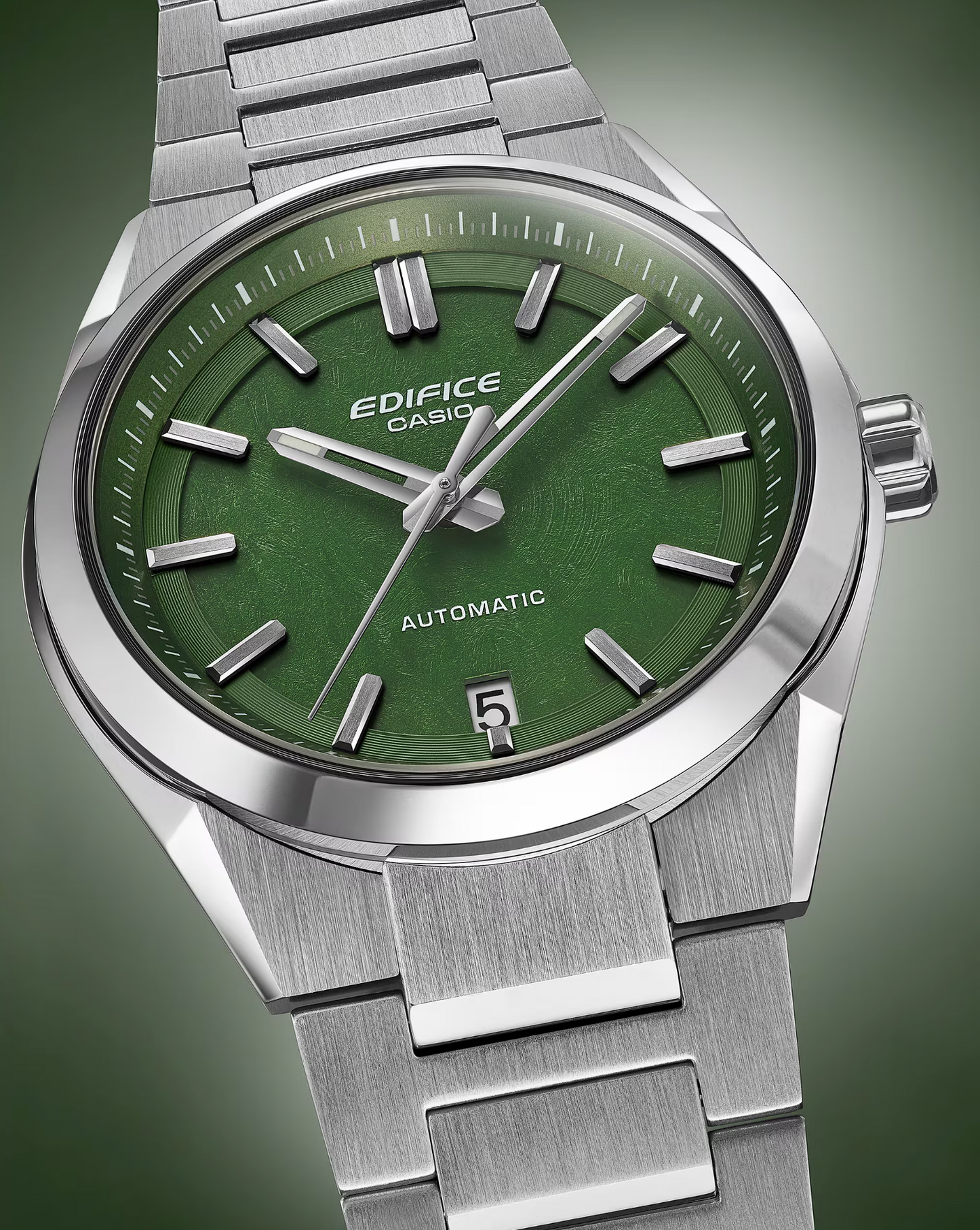 Casio Edifice watch with green face and silver metal strap on a gradient background