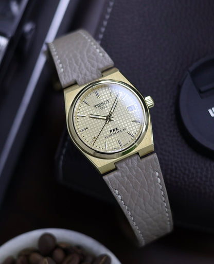 (Mint Condition + Box & 3 Custom Straps worth ₹9500) TISSOT PRX Powermatic 80 35mm Gold Champagne Dial (Pre Owned)