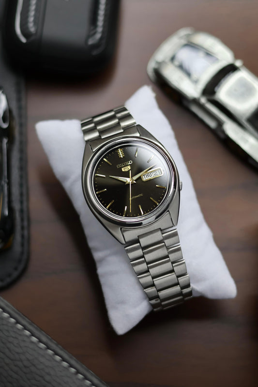 Seiko 5 Black Dial with Gold Accents & Glass Back (Pre Owned)